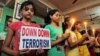 FILE - Students in Agartala, India, show solidarity with victims of a terrorist attack on a Bangladeshi café in early July. On Tuesday, Indian and U.S. officials announced plans for greater cooperation in combatting terrorism.