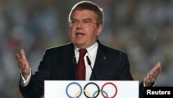 FILE - International Olympic Committee (IOC) President Thomas Bach delivers a speech during the closing ceremony of the 2014 Nanjing Youth Olympic Games in Nanjing, Jiangsu province, August 2014.