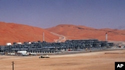FILE - An industrial plant strips natural gas from freshly pumped crude oil is seen at Saudi Aramco's Shaybah oil field at Shaybah in Saudi Arabia's Rub al-Khali desert.