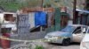 The body of Mexican photojournalist Margarito Martinez Esquivel (obscured) lies on the ground next to his car after he was killed outside his home, in Tijuana, Mexico, Jan. 17, 2022.