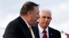 Vice President Mike Pence, left, and Secretary of State Mike Pompeo, walk to a car to drive to a meeting with Turkish President Recep Tayyip Erdogan, in Ankara, Turkey, Thursday, Oct. 17, 2019. (AP Photo/Jacquelyn Martin)