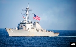 FILE - The USS Stethem, a U.S. Navy destroyer, transits waters east of the Korean Peninsula during Operation Foal Eagle, March 22, 2017.