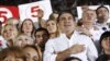 Georgia's President and leader of the ruling United National Movement party Mikheil Saakashvili gestures during the national anthem with his supporters during an election rally at a stadium in Tbilisi September 28, 2012. REUTERS/David Mdzinarishvili (GEOR