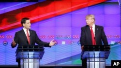 presidential candidate, businessman Donald Trump listens, during the Republican presidential debate sponsored by CNN, Salem Media Group and the Washington Times at the University of Miami, Thursday, March 10, 2016.