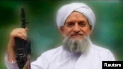 FILE - A photo of Al-Qaeda's new leader, Egyptian Ayman al-Zawahiri, is seen in this still image taken from a video released on Sept. 12, 2011.