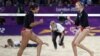 Kerri Walsh Jennings (R) and Misty May-Treanor of the US celebrate a point against Australia during women's beach volleyball match at 2012 Olympics
