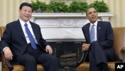 President Barack Obama meets with China then-Vice President Xi Jinping at the White House, Washington, Feb., 14, 2012.
