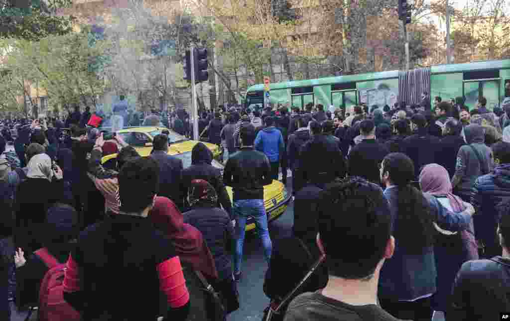 This photo taken by an individual not employed by the Associated Press and obtained by the AP outside Iran, demonstrators attend a protest over Iran's weak economy, in Tehran, Iran, Dec. 30, 2017.