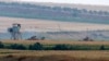 Turkish army tanks hold positions near the border with Syria, in the outskirts of the village of Elbeyi, east of the town of Kilis, in southeaster Turkey, July 23, 2015. 