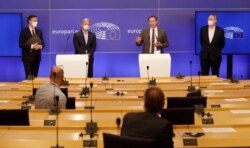 Members of European Parliament, David McAllister, Andreas Schieder, Christophe Hansen and Bernd Lange participate in a media conference after a debate on the EU-UK trade and cooperation agreement at the EU Parliament in Brussels, April 27, 2021.
