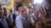 Republican presidential candidate, former Massachusetts Gov. Mitt Romney shakes hands during a campaign rally, Saturday, Sept. 1, 2012, in Cincinnati, Ohio.