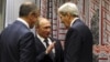 Russia's President Vladimir Putin (C), Foreign Minister Sergei Lavrov (L) and U.S. Secretary of State John Kerry attend a meeting on the sidelines of the United Nations General Assembly in New York, Sept. 28, 2015. 