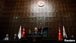 FILE - Turkish President Recep Tayyip Erdogan addresses members of parliament from his ruling AK Party (AKP) during a meeting at the Turkish parliament in Ankara, Turkey, March 6, 2018. 
