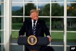 FILE - President Donald Trump speaks as he meets with business leaders, Aug. 7, 2018, at Trump National Golf Club in Bedminster, N.J.