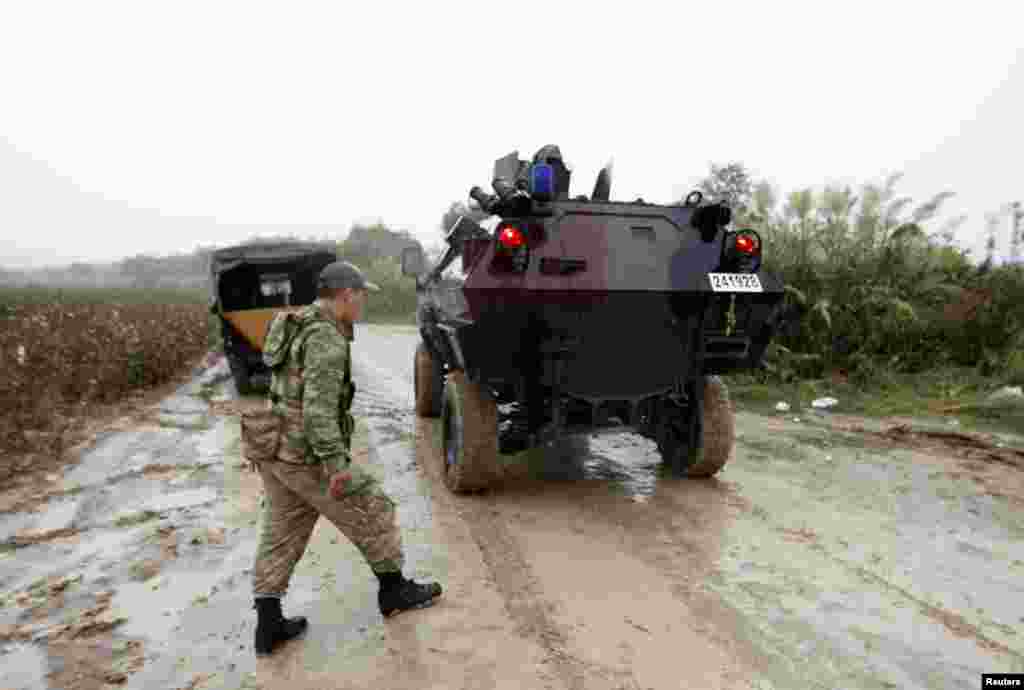 Turkish soldiers in a military vehicle patrol the Turkish-Syrian border near the village of Hacipasa in Hatay province, Turkey October 11, 2012.