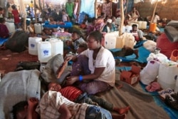 FILE - Ethiopian refugees who fled fighting in Tigray province lie in a hut at the Um Rakuba camp in Sudan's eastern Gedaref province, Nov. 18, 2020.