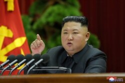 North Korean leader Kim Jong Un speaks during the 5th Plenary Meeting of the 7th Central Committee of the Workers' Party of Korea in this undated photo released Dec. 28, 2019, by the Korean Central News Agency.