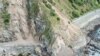 FILE - Landslides block State Highway One near Kaikoura on the upper east coast of New Zealand's South Island following an earthquake, Nov. 14, 2016.