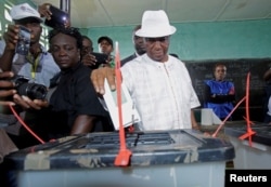 FILE - Joseph Nyuma Boakai, Liberia's vice president and presidential candidate of Unity Party (UP), votes at a polling station in Monrovia, Liberia. Oct. 10, 2017.