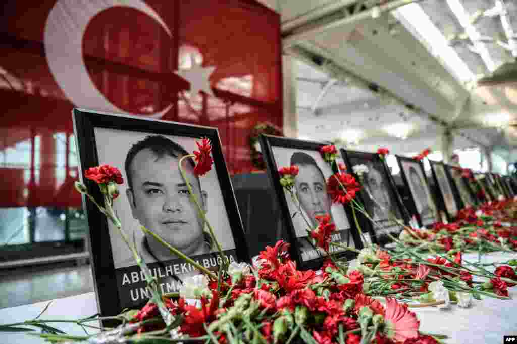 Flowers have been placed by the pictures of airport employees killed by the triple suicide bombing and gun attack at Istanbul's Ataturk Airport in Turkey. The death toll from the June 28 attack has risen to 43 including 19 foreigners.