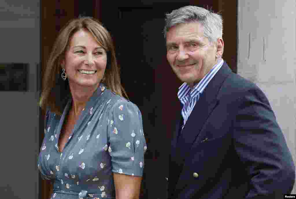 Michael and Carole Middleton arrive at the Lindo Wing of St. Mary's Hospital the day after their daughter, Britain's Catherine, Duchess of Cambridge, gave birth to a baby boy, London, July 23, 2013. 