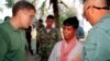 Former Khmer Rouge guerilla Mao Run, center, speaks to Robert L. Jones, left, deputy assistant of Defense for POW/MIA on the island of Koh Tang, Cambodia, Jan 28, 2000. Mao Run was part of the Khmer Rouge unit who fought with U.S. Marines on May 15, 1975. (AP Photo/Heng Sinith)