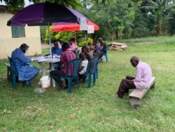 Members of Kirembo village are prepared for the Ebola trial vaccination in Kasese district, Uganda, June 16, 2019. (H. Athumani for VOA)