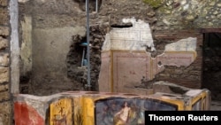 A fresco on an ancient counter depicting a nymph riding a horse uncovered during excavations in Pompeii, Italy, is seen in this handout picture released Dec. 26, 2020.