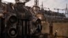 Ukrainian energy workers carry out repairs despite Russia's pounding of country's power grid 