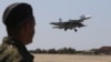 FILE - A Russian SU-33 naval fighter plane flies during a drill at the Nitka training complex in the village of Novofedorovka, west of the Crimean city of Simferopol, Aug. 27, 2015. 