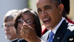 President Barack Obama gestures while speaking in the Rose Garden of the White House in Washington on Oct. 1, 2013, about the government shutdown. 