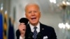 Presiden AS Joe Biden menggenggam maskernya saat berbicara mengenai pandemo COVID-19 dari East Room di Gedung Putih, Kamis, 11 Maret 2021.