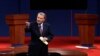 This Oct. 3, 2012 file photo shows moderator Jim Lehrer addressing the audience before the first presidential debate at the University of Denver in Denver. 