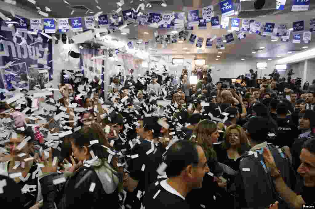 Supporters of Yair Lapid's Yesh Atid (There is a Future) party celebrate at the party's headquarters in Tel Aviv, Israel, January 23, 2013.