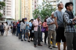 People line up to vote in district council elections in South Horizons in Hong Kong, China November 23, 2019. REUTERS/Laurel Chor