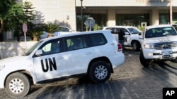 FILE - A convoy of chemical weapons disarmament experts depart the Four Seasons Hotel in Damascus, Syria, Oct. 8, 2013. Activists say they have documented 18 cases of chlorine gas used in the country's rebel-held north since March 6, 2015.