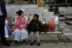 A Yemeni girl and boy wait in the departure lounge at Sanaa International airport, in Yemen, Feb. 3, 2020. A U.N. medical relief flight carrying patients from Yemen's rebel-held capital took off Feb. 2, the first such aid flight in over three years.
