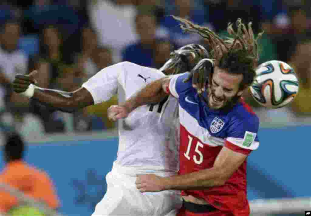 United States' Kyle Beckerman struggles to head the ball during the group G World Cup soccer match between Ghana and the United States at the Arena das Dunas in Natal, Brazil, Monday, June 16, 2014. (AP Photo)