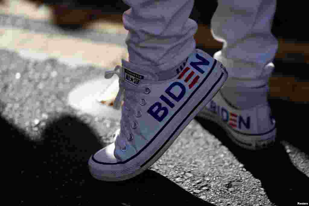 A supporter wearing sneakers with Biden's name is seen as people celebrate in the Castro district after news media declared U.S. presidential nominee Joe Biden the winner of the 2020 election.