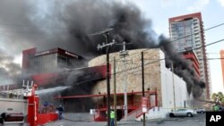 Smoke billows from the Casino Royale in Monterrey, Mexico, Aug. 25, 2011.