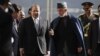 Afghan President Hamid Karzai, center right, talks with Pakistan's Prime Minister Nawaz Sharif while they inspect a guard of honor in Kabul, Afghanistan, Nov. 30, 2013. 