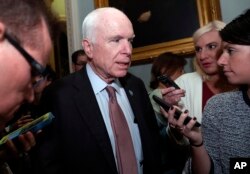 Sen. John McCain, R-Ariz., speaks with reporters before heading into a policy luncheon on Capitol Hill in Washington, Sept. 19, 2017.