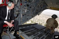 U.S. Defense Secretary Jim Mattis looks out over Kabul as he arrives via helicopter at Resolute Support headquarters in Kabul, Afghanistan, April 24, 2017.