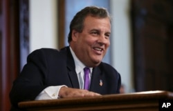 FILE - New Jersey Gov. Chris Christie laughs at a question from the media after speaking in Trenton, N.J., Aug. 29, 2016.