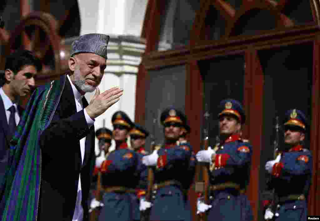 Former president Hamid Karzai arrives for the inauguration of the newly-elected president Ashraf Ghani, in Kabul, Sept. 29, 2014.