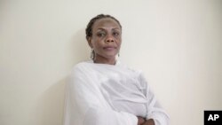 Sudanese activist Khalda Saber, poses for a photograph at her apartment, in Cairo, Egypt, Sept. 4, 2019.