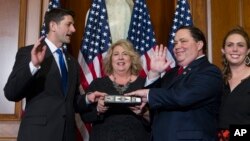FILE - House Speaker Paul Ryan of Wisconsin administers the House oath of office to Rep. Blake Farenthold, R-Texas, during a mock swearing-in ceremony on Capitol Hill in Washington, Jan. 3, 2017.