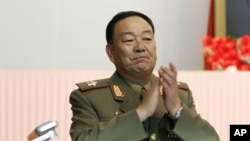 FILE - Recently executed then-Vice Marshal Hyon Yong Chol applauds during a meeting at the April 25 House of Culture announcing North Korean leader Kim Jong Un's new title of marshal.