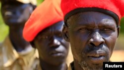 FILE - South Sudanese soldiers listen during a briefing at the army general headquarters in Juba. Government troops began withdrawing from Juba as called for in a peace agreement signed last August.