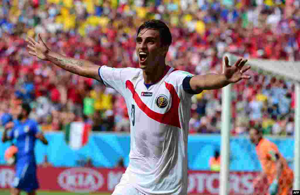 Costa Rica's forward Bryan Ruiz celebrates after scoring his team's first goal during a Group D match between Italy and Costa Rica at the Pernambuco Arena in Recife during the 2014 FIFA World Cup in Brazil.
